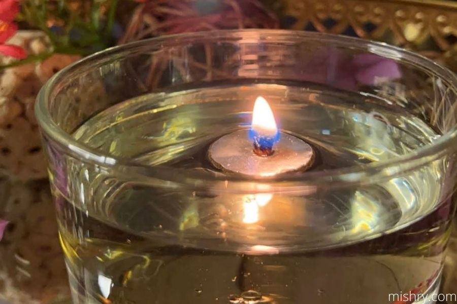 the burning floating diya wick